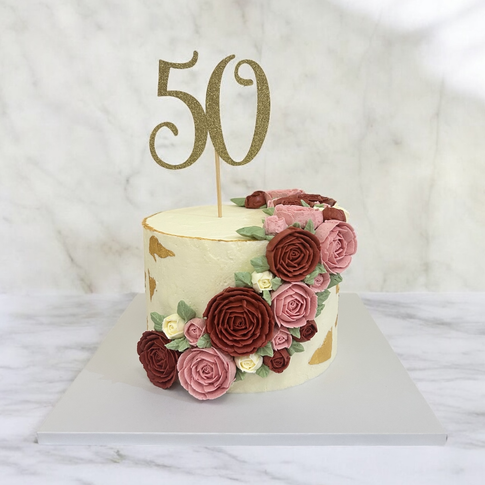 50th birthday celebration cake with buttercream roses