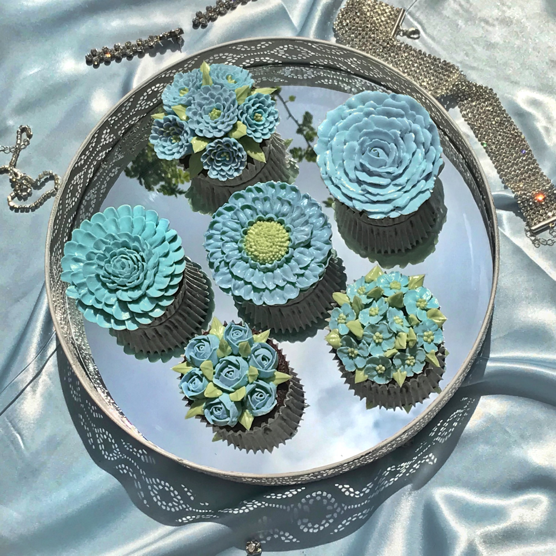 Blue floral cupcakes on elegant tray